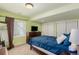 Bedroom with green walls, carpet and comfortable mattress at 7852 Solstice Way, Castle Rock, CO 80108