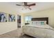 Inviting bedroom with a cozy bed, side table, and a convenient closet space for easy storage and access at 7852 Solstice Way, Castle Rock, CO 80108
