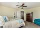 Bright bedroom with a bed, dresser, and access to a nearby bathroom, offering comfort and convenience at 7852 Solstice Way, Castle Rock, CO 80108