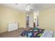 Bright bedroom with neutral colors, featuring easy access to an attached bathroom and closet space at 7852 Solstice Way, Castle Rock, CO 80108
