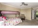 Comfortable bedroom featuring a bunk bed with a playful design, complemented by a relaxing rocking chair at 7852 Solstice Way, Castle Rock, CO 80108