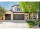 Charming two-story home with brick and light siding, spacious three-car garage, and a well-maintained front yard at 7852 Solstice Way, Castle Rock, CO 80108
