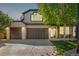 Inviting two-story home with a three-car garage and manicured lawn at 7852 Solstice Way, Castle Rock, CO 80108
