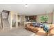 Open-concept living space connects the living room to the kitchen with ample natural light at 7852 Solstice Way, Castle Rock, CO 80108