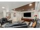 Spacious living room featuring a large TV, comfortable seating, and recessed lighting at 7852 Solstice Way, Castle Rock, CO 80108