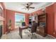 Inviting office space featuring a large window with scenic views and stylish built-in shelving for ample storage at 7852 Solstice Way, Castle Rock, CO 80108