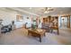 Open basement layout provides many seating areas, a treadmill, desk, and shelving at 12973 Mesa View Rd, Larkspur, CO 80118