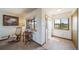 Welcoming foyer with tile flooring, coat closet, and windows offering views of the surrounding landscape at 12973 Mesa View Rd, Larkspur, CO 80118