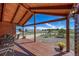 Comfortable covered front porch with outdoor seating area and scenic views of the surrounding landscape at 12973 Mesa View Rd, Larkspur, CO 80118