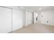 Clean basement with neutral carpet, white walls, baseboards, and sliding door closet at 3529 N Garfield St, Denver, CO 80205