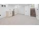 Finished basement with a wet bar, plush carpet, and stairs to the main level at 3529 N Garfield St, Denver, CO 80205