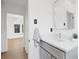 Stylish bathroom features a gray vanity and tile flooring at 3529 N Garfield St, Denver, CO 80205