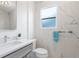 Elegant bathroom features marble tile, a sleek vanity, and a modern mirror at 3529 N Garfield St, Denver, CO 80205