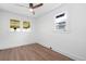 Bright bedroom features multiple windows and a ceiling fan at 3529 N Garfield St, Denver, CO 80205