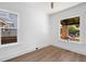 Well-lit bedroom with two large windows and wood-look flooring at 3529 N Garfield St, Denver, CO 80205