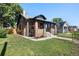 Well-maintained home showcasing a lush green lawn, mature trees, and classic architectural details at 3529 N Garfield St, Denver, CO 80205