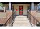 Welcoming entryway with a decorative security door, bright red mailbox, and brick accents at 3529 N Garfield St, Denver, CO 80205