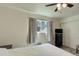 Bedroom with ceiling fan and a large window with curtains at 3550 S Harlan St # 249, Denver, CO 80235