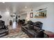 The living room features a leather reclining sofa set with outdoor accessories and light at 3550 S Harlan St # 249, Denver, CO 80235