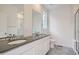 Bathroom with double vanity, gray countertops, and tiled floor at 14556 W 91St Ave # D, Arvada, CO 80005