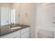 Modern bathroom with vanity, sink, and bathtub at 14556 W 91St Ave # D, Arvada, CO 80005