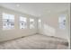 Bright bedroom with neutral carpeting and multiple windows at 14556 W 91St Ave # D, Arvada, CO 80005