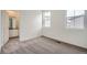 Bedroom with carpet, two windows, and an ensuite bathroom at 14556 W 91St Ave # D, Arvada, CO 80005