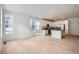 Open concept kitchen with white cabinets, stainless steel appliances, and island at 14556 W 91St Ave # D, Arvada, CO 80005