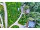 Aerial view of home, wooded lot, and driveway at 8758 S Murphy Gulch Rd, Littleton, CO 80127