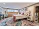 Inviting bedroom with decorative rug, vintage bed frame, and comfortable decor at 8758 S Murphy Gulch Rd, Littleton, CO 80127