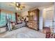 Relaxing bedroom with a decorative rug, matching furniture set, and plenty of natural light at 8758 S Murphy Gulch Rd, Littleton, CO 80127