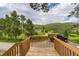 Scenic view from wooden deck overlooking the lush green hills at 8758 S Murphy Gulch Rd, Littleton, CO 80127