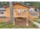 Charming log cabin with spacious deck and landscaped yard at 8758 S Murphy Gulch Rd, Littleton, CO 80127
