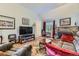 Cozy living room with stone fireplace, comfortable seating, and elegant decor at 8758 S Murphy Gulch Rd, Littleton, CO 80127
