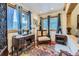 Sunlit office space with beautiful views, vintage furniture, and charming decor at 8758 S Murphy Gulch Rd, Littleton, CO 80127