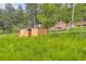View of yard and storage shed with surrounding trees at 8758 S Murphy Gulch Rd, Littleton, CO 80127