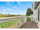 Wood deck featuring a great view of backyard open space, green grass and blue skies at 1461 S Danube Way # 104, Aurora, CO 80017