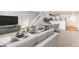 Inviting living room with neutral tones, leading to a modern kitchen and dining area at 1461 S Danube Way # 104, Aurora, CO 80017