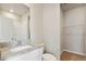 Clean bathroom showcasing granite countertops, a white vanity, toilet, and a shower-tub combination at 5863 Sawdust Dr, Brighton, CO 80601
