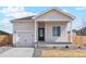 Charming single-Gathering home with a well-manicured lawn and an inviting front porch at 5863 Sawdust Dr, Brighton, CO 80601