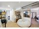 Spacious basement with large beanbag chair and mirror at 2469 S Broadway, Denver, CO 80210