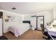 Basement bedroom with a full-size bed and desk at 2469 S Broadway, Denver, CO 80210