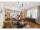 Bright dining room with hardwood floors and an adjacent kitchen at 2469 S Broadway, Denver, CO 80210
