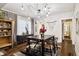 Open concept dining area with hardwood floors and a view of the kitchen at 2469 S Broadway, Denver, CO 80210
