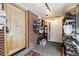 Enclosed entryway with storage, brick walls, and shoe racks at 2469 S Broadway, Denver, CO 80210
