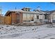 Brick building with large windows, steps, and small yard at 2469 S Broadway, Denver, CO 80210