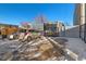 Property exterior showcasing parking and gated access at 2469 S Broadway, Denver, CO 80210