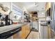Cozy kitchen with stainless steel appliances and ample counter space at 2469 S Broadway, Denver, CO 80210