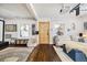 Living room features hardwood floors, a cozy seating area, and a projector at 2469 S Broadway, Denver, CO 80210