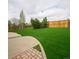Green backyard with wooden fence at 510 Fairhaven St, Castle Rock, CO 80104